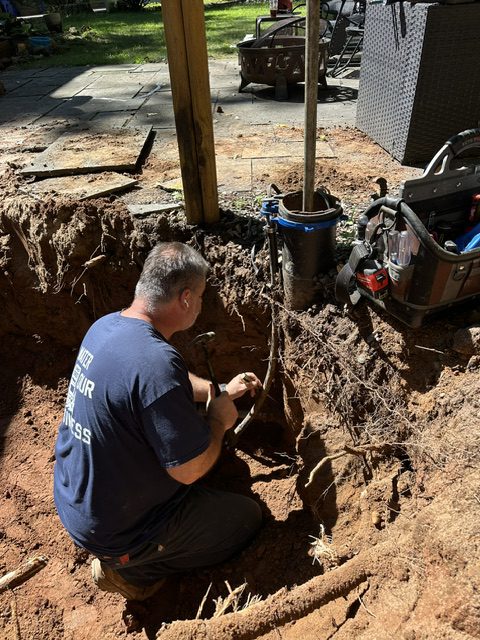 Greco & Haines technician servicing a residential well system in Connecticut
