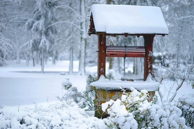 water well covered in snow